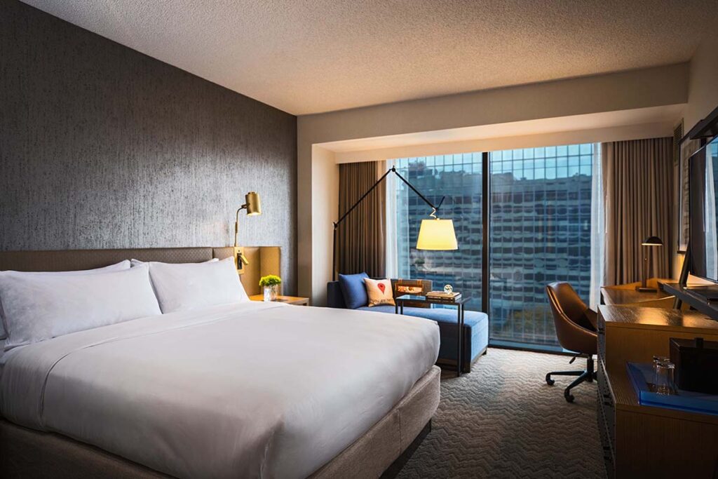 Renaissance Toledo Downtown Hotel room with a bed and large window