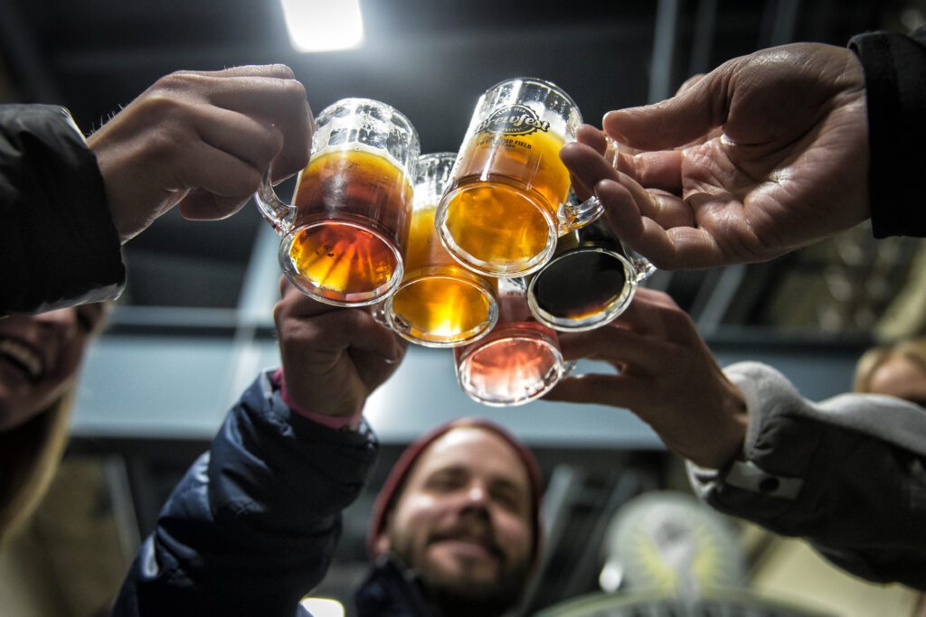 People at Brewfest cheersing beer