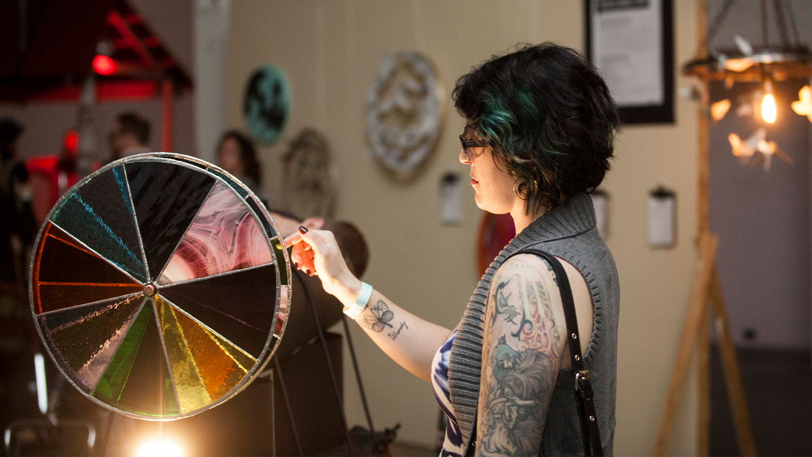 a woman looking around at artomatic 419