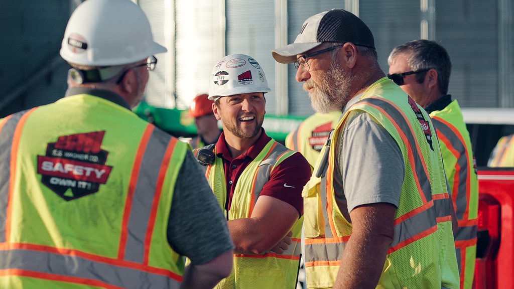 E.S. Wagner crew members talking on site during a toolbox talk